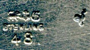 This bookmark was made in the US by Gorham Mfg. Company. It is marked with the manufacturers mark, sterling and 48, the number from the catalogue. This particular bookmarks has the rooster date mark indicating 1890. The top has a highly detailed hummingbird and flower with the wing of the bird forming the top blade. 