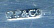 This bookmark was made in England by Payton, Pepper & Co., Birmingham with the hallmark of PP&Co. The date and city marks have been rubbed out. It is in the shape of a knife with an intricately designed handle.