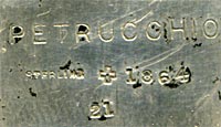 his bookmark was made in the US by J.F. Fradley. It is marked on the back with sterling, the manufacturers hallmark of a cross, the numbers 1864 and 21, and Petrucchio. This is a figure of the Shakespeare character Petrucchio from the play "Taming of the Shrew." The date is 1890 - 1936.