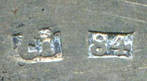 This bookmark was made in a European country. It has two hallmarks but one is indecipherable. The other, 84 is possibly Russian but the inscription, 21s Mai, 1866 is French. The bookmark is in the shape of an anchor.