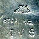 This bookmark was made in the US by La Pierre. It has the manufacturers hallmark, sterling and the number 449. The top has a wreath of flowers with a ribbon on top.