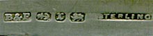 This bookmark was made in Birmingham England. It has the hallmarks for 1897 and a manufacturer of B&F. The top is a highly detailed relief bearded man in long robes.