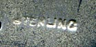 This bookmark was made in the US by an unknown manufacturer. It is marked sterling on the back. The top is an art nouveau woman's head with long flowing hair.