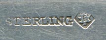 TThis bookmark was made in Canada by P. W. Ellis. It is marked sterling with the manufacturers mark on the back. The Top is a girl dressed for winter, a maple leaf with a banner across it saying "Miss Canada". The blade is inscribed Yarmouth 16 Sep 92. Yarmouth is in Nova Scotia.