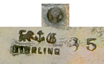 This bookmark was made in the US by Gorham Mfg. Company. It is marked with the manufacturers mark, sterling 36 and a star (indicating 1871). 36 is the number from the Autumn 1888 catalogue.