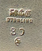 This bookmark was made in the US by Gorham Mfg. Company. It is marked with the manufacturers mark, sterling 30 and a star (indicating 1871). 30 is the number from the Autumn 1888 catalogue.
