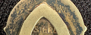 This bookmark was made in the US by F.A. Hermann Co. It is hallmarked sterling on the back. The top is an enamel shield with a red star and horns?. This is possibly a university emblem. The date is 1900 - 1910.