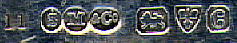 This bookmark is made in Chester England by Sampson Mordan & Co. It is marked 11 SM & Co. and the date letter C indicating 1903. It has a pig on the top.