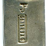 This bookmark is American made by the Navaho tribe sometime in the 1970's. The top is in the shape of a Buffalo with a stamped sun and arrow. The back is marked sterling and a symbol that looks like a combined J and F.