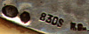 This bookmark is from Norway. The date is 1900 - 1910. The top blade is silver and is marked 830S H.Gm. with two other marks. The bottom blade is celluloid made to look like ivory.