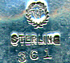 This bookmark is made in the US by Woodside Sterling Co. sometime between 1896 and 1920. It is marked with the manufacturers hallmark, Sterling and the number 361, probably a catalog number. It is very thin.
