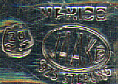 This bookmark was made in Mexico. It is marked Mexico, the makers mark JAAKE, 925 Sterling and the standard Mexican mark with the number 20 for this manufacturer. This bookmark is more of a clip but could serve the same purpose. The top blade is a Lion reading a book. Date is unknown.