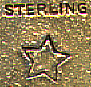 his bookmark was made in the US by the Thomas F. Brogan company from New York. The date is between 1896 - 1910. It is a silver and blue enamel heart and a star between a ribbon. The manufacturers mark of a five pointed star and the word sterling appears on the back of the heart and the star. 