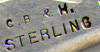 This bookmark was made in the US by Codding Bros & Heilborn between 1880 and 1890. It is marked C B & H Sterling on the back. The top is in the shape of a feather. This was probably used as a paper cutter as well as a bookmark.