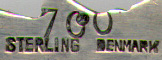 This bookmark was made in Denmark. It is marked Sterling Denmark and the number 700 stamped over. It is a figural tulip on the top. The date is 1950 - 1960.