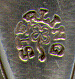 This bookmark was made in the US by Parks Bros. & Rogers. It is marked with the manufacturers hallmark surrounded by the word sterling. The top is a figural flower. The date is 1900 - 1910.  