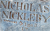 This bookmark was made in the US by J. F. Fradley & Co., a small New York silver manufacturer in business from 1870 - 1936. It is in the shape of a man, Nicholas Nickelby, from the Charles Dickens book. It is marked Sterling, the cross hallmark, 1863 and 17. Also inscribed on the back is "Nicholas Nickelby". Date is 1890 - 1936.