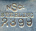  This bookmark was made in the US by Newburyport Silver Co. It is marked with the manufacturers mark, sterling and the number 2399. The top of the bookmark is a magnifying glass. The date is 1905 - 1914.  