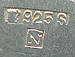  This bookmark was made in Norway. It is marked with N and 925S indicating sterling. It has two silver and enamel flowers connected by a blue silk ribbon. The date is 1950 - 1960.  