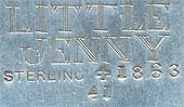  This bookmark was made in the US by J.F. Fradley. It is marked on the back with sterling, the manufacturers hallmark of a cross, the numbers 1863 and 41, and Little Jenny. This is a figure of the Dickens character Jenny Wren from the book &quot;Our Mutual Friend.&quot; The date is 1890 - 1936.  