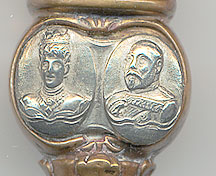  This bookmark was made in Europe by an unknown manufacturer. It is a gilt bookmark produced to commemorative the coronation of Edward VII and Queen Alexandra in 1902. It has gold over brass blades, with engravings of the heads of the king and queen in silver, and topped with crown and center red marble. The date is 1902 - 1910. 
