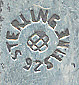  This bookmark was made in the US by Unger Bros. It is marked with the makers hallmark on the back. The is a high relief picture of two cherub faces. This bookmark can be found in the 1904 Unger Bros. catalog on page 155 number 8657.  
