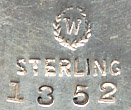  This bookmark was made in the US by Woodside Sterling Co. It is marked sterling 1352 along with the manufacturers hallmark. It is an art nouveau design with a fancy fleur-de-lis on top.   