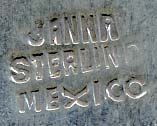  This bookmark was made in Mexico. It is marked Janna Sterling Mexico on the back. The top is a figural lion reading a book. The date is 1970 - 1980.    