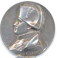  This bookmark was made in France. The top is a high relief bust of Napoleon as designed by the famous French artist E. Seurre. The top blade has a 5 pointed star and next to it is inscribed Malmaison which is the house that Napoleon's wife, Josephine purchased in 1799 and where he governed the country. It is now a museum and this is possibly a souvenir from there.   