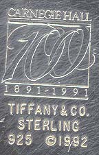  This bookmark was made in the US by Tiffany and Co. It was made to commemorate Carnegie Hall's 100 years 1891 - 1991. It is in the shape of a grand piano.  The date is 1992.  