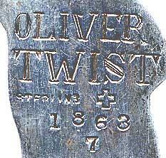  This bookmark was made in the US by J.F. Fradley. It is marked on the back with sterling, the manufacturers hallmark of a cross, the number 7, and Oliver Twist. This is a figure of the Dickens character from the book with the same name. The date is 1890 - 1936. 