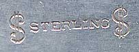  This bookmark was made in the US by an unknown manufacturer. It has an unknown hallmark on the back along with the word sterling. The top blade is a high relief cluster of leaves. The date is 1900 - 1910.  