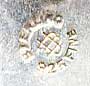  This bookmark is made in the US by Unger Bros. It is marked with the manufacturers hallmark on the back. The top is a flower.  The date is 1900 - 1910.   