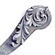 This bookmark is made by Gorham and is marked with the manufacturers hallmark and the number 71. It is an interesting shape with the top blade swirling around in the shape of a leaf.