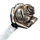 This bookmark was made in the US by Unger Bros. It is hallmarked with the manufacturers mark of an intertwined U and B. The top is a rose flower just starting to bloom. To see the catalog page select "Catalog Unger Bros 1904" from the Books, Catalogs and Patents dropdown menu.