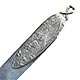 This bookmark is from France. It has tiny french hallmarks on the top loop and another mark on the back. The top blade is an art nouveau design of lily-of-the-valley flowers. The date is circa 1900.
