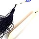 This bookmark was probably made in Europe somewhere. It is celluloid with a celluloid link chain and a large blue tassel. The date is 1920 - 1930.