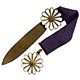 This bookmark was made in Europe. It is made of brass and enamel and has a blue ribbon between the two pieces. The shape is a daisy flower. 