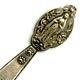 This bookmark was made in France. It is made of silver plate over brass. The top is a picture of a woman praying with long robes. A religious symbol no doubt. On the top blade is a crest with the initials ND.