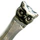 This bookmark was made in Denmark and imported into Sweden. It is marked H.J. 830s and has the Swedish import marks. The top is the face of an owl. The top blade is inscribed 26.I.1921.  