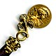 This bookmark was probably produced in France. It is made of mother-of-pearl and gold plate over pot metal. It has two sided coin of women heads held up by an iris flower. The blades are light and dark MOP. The date is 1880 - 1900.