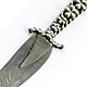 This bookmark was made in the US by an unknown manufacturer. Marked only sterling on the back, it is in the shape of a knife with a rope and flower handle.