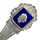 This bookmark was made in Denmark by Eiler & Marløe of Copenhagen. The back is hallmarked 830s and E & M. The top is a detailed bust of Hans Christian Andersen surrounded by a shield of deep blue enamel.