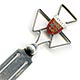 This bookmark, a 'Jersey' souvenir, was made in Birmingham England in 1925 by E Horton & Co. It is a George V English sterling silver bookmark with an enamel coat of arms on a three point cross above a ball.