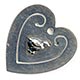 This bookmark was made in the US by an unknown manufacturer. It is marked sterling on the back. It is in the shape of a heart with a baby chick in the center of the  inside blade.