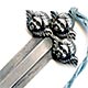 This bookmark was made in the US by an unknown manufacturer. The top has three cherub faces it high relief and has a 10.5 inch tassel. 