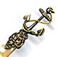 This bookmark was probably produced in France. It is made of mother-of-pearl and brass plate over pot metal. It has a very detailed anchor wrapped in a gold rope. The blades are light and dark MOP. The date is 1880 - 1900.