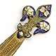 This bookmark is made of pot metal with a gilt finish and has  enamel on the top part in the shape of a fleur-de-lis. Date is unknown. It's probably French made.