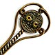 This bookmark was made in France. It is brass and the top is a relief picture of an owl with yellow glass eyes. The date is 1890 - 1910. 
