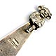 This bookmark was made in Birmingham England by an unknown manufacturer with the hallmark of B.H.J. It has the date mark of e indicating 1904. The top is a figural Lincolnshire Imp, seen in the Angel Choir at Lincoln Cathedral.